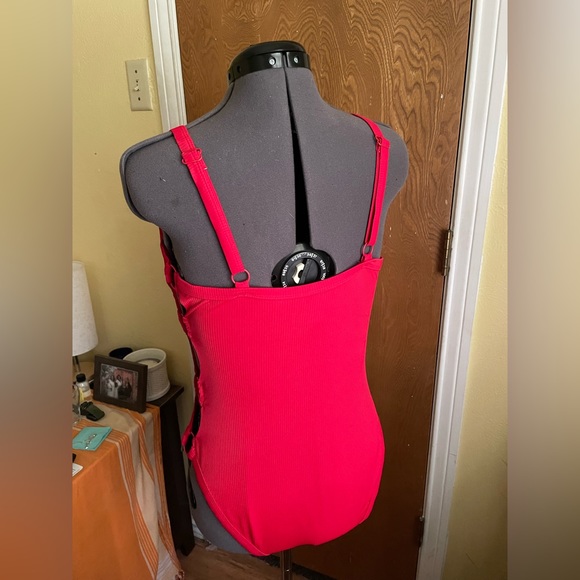 Red one piece with cutout details on side. No boundaries, size large. - Picture 3 of 3